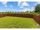 Spacious backyard featuring a wooden privacy fence and a grassy lawn at 4531 Dalbeth St, Charlotte, NC 28213