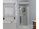 Bright bathroom with a soaking tub, separate shower and light and airy decor at 4531 Dalbeth St, Charlotte, NC 28213