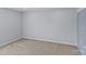 Bedroom featuring neutral carpet, light blue paint, closet doors, and electrical outlets at 4531 Dalbeth St, Charlotte, NC 28213