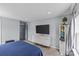 Bedroom with mounted television, neutral decor, and a large window for ample natural light at 4531 Dalbeth St, Charlotte, NC 28213