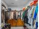 Walk-in closet is equipped with shelves, hanging rods, and storage for clothing and shoes at 4531 Dalbeth St, Charlotte, NC 28213