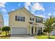 Charming two-story home with a manicured lawn and attached two-car garage at 4531 Dalbeth St, Charlotte, NC 28213