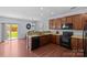 Bright kitchen featuring wood cabinets with modern appliances at 4531 Dalbeth St, Charlotte, NC 28213
