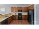 Functional kitchen with wood cabinets and modern appliances at 4531 Dalbeth St, Charlotte, NC 28213
