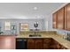View of kitchen featuring sleek appliances, an open layout and adjacent dining space at 4531 Dalbeth St, Charlotte, NC 28213
