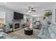 Bright living room featuring a fireplace, TV, and plush seating at 4531 Dalbeth St, Charlotte, NC 28213