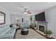 Well-decorated living room with a fireplace, large TV, and plush seating arrangements at 4531 Dalbeth St, Charlotte, NC 28213