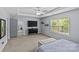 Bright bedroom with large window, mounted television and a comfortable place to relax at 4531 Dalbeth St, Charlotte, NC 28213