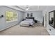 Serene main bedroom with tray ceiling, neutral tones, and a comfortable king-sized bed at 4531 Dalbeth St, Charlotte, NC 28213