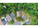 Aerial view of the property outlined in red, nestled in a neighborhood with mature trees at 459 Presidents Ct, Charlotte, NC 28217