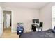 Bedroom with desk setup, window, dark bedding, and view into other rooms at 459 Presidents Ct, Charlotte, NC 28217