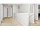 Upper hallway showcasing neutral tones and access to multiple rooms, offering a clean and functional transition space at 459 Presidents Ct, Charlotte, NC 28217