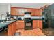 Functional kitchen featuring sleek black appliances, ample cabinet space, and durable countertops for efficient meal preparation at 459 Presidents Ct, Charlotte, NC 28217