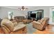 Cozy living room with plush seating, a modern entertainment center, and ample space for relaxation and entertainment at 459 Presidents Ct, Charlotte, NC 28217