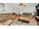Well-lit living room offering cozy seating arrangements, a decorative rug, and a relaxed ambiance, perfect for Gathering time at 459 Presidents Ct, Charlotte, NC 28217