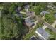 Aerial view of a well-manicured lawn, beautiful brick home, wooded backyard, and quiet suburban neighborhood at 4619 Glasgow Ct, Gastonia, NC 28056