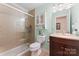 This is a full bathroom with a toilet, cabinet sink and standing shower that has glass doors at 4619 Glasgow Ct, Gastonia, NC 28056