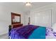 Comfortable bedroom with a blanket, a dresser with mirror and a closet door at 4619 Glasgow Ct, Gastonia, NC 28056