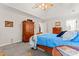 Comfortable bedroom has a decorative wardrobe, ceiling fan, and is well lit at 4619 Glasgow Ct, Gastonia, NC 28056