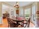 Cozy dining room with hardwood floors, natural light, wooden table, and seating for six at 4619 Glasgow Ct, Gastonia, NC 28056