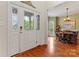 Bright foyer featuring a decorative glass front door and view to dining room at 4619 Glasgow Ct, Gastonia, NC 28056