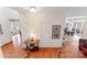 Hallway with hardwood flooring and natural light coming from windows of nearby rooms at 4619 Glasgow Ct, Gastonia, NC 28056