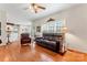 Spacious living room features hardwood flooring, great natural light, and easy flow to kitchen area at 4619 Glasgow Ct, Gastonia, NC 28056
