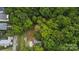 Overhead view of a wooded property featuring a single-Gathering home, small outbuilding, and mature trees at 500 Peigler Nw St # Lots 1 & 2, Concord, NC 28027