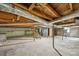 Unfinished basement with exposed ceiling and stairs, offering potential for customization and storage at 500 Peigler Nw St # Lots 1 & 2, Concord, NC 28027