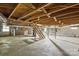 Large unfinished basement with exposed ceiling, stairs, and support beams, offering storage and utility connections at 500 Peigler Nw St # Lots 1 & 2, Concord, NC 28027