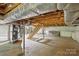 Spacious unfinished basement with wooden ceiling and support beams provides ample storage or workshop space at 500 Peigler Nw St # Lots 1 & 2, Concord, NC 28027