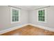 Bedroom with hardwood floors, natural light, and neutral paint at 500 Peigler Nw St # Lots 1 & 2, Concord, NC 28027