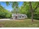 Charming single-story home with a welcoming front porch and mature trees at 500 Peigler Nw St # Lots 1 & 2, Concord, NC 28027