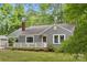 Cozy home with a gray exterior, complemented by white trim and a inviting purple front door at 500 Peigler Nw St # Lots 1 & 2, Concord, NC 28027