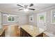 Kitchen featuring granite countertops and an island open to an adjacent living area, enhancing connectivity at 500 Peigler Nw St # Lots 1 & 2, Concord, NC 28027