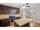 Kitchen featuring granite countertops, stainless steel appliances, and an island, perfect for cooking at 500 Peigler Nw St # Lots 1 & 2, Concord, NC 28027