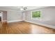 Inviting living room featuring gleaming hardwood floors, neutral walls, and abundant natural light at 500 Peigler Nw St # Lots 1 & 2, Concord, NC 28027