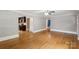 Bright living room with hardwood floors and a view into the updated kitchen and bathroom at 500 Peigler Nw St # Lots 1 & 2, Concord, NC 28027
