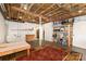 Large unfinished basement area with painted walls, exposed ceiling, rug and shelving at 507 Richards Dr, Shelby, NC 28150