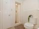 Full bathroom featuring white tile, toilet, and a walk-in shower with curtain at 507 Richards Dr, Shelby, NC 28150