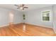 Spacious bedroom with hardwood floors, a ceiling fan, and an en suite bathroom at 507 Richards Dr, Shelby, NC 28150