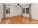 Sunlit bedroom boasts hardwood floors and large windows with wooded views at 507 Richards Dr, Shelby, NC 28150