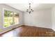 Dining room with hardwood floors, natural light, and a classic chandelier at 507 Richards Dr, Shelby, NC 28150