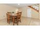 Traditional dining room features wood table with seating, neutral walls, and staircase access at 507 Richards Dr, Shelby, NC 28150