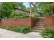 Brick-walled property with stairway presents a well-maintained exterior and lush garden, creating a welcoming ambiance at 507 Richards Dr, Shelby, NC 28150