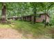 Brick home on a grassy lot surrounded by mature trees at 507 Richards Dr, Shelby, NC 28150