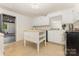 Bright kitchen featuring white cabinets, center island, and stainless steel appliances at 507 Richards Dr, Shelby, NC 28150