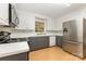 Bright kitchen featuring stainless steel appliances, white cabinets, and modern countertops at 507 Richards Dr, Shelby, NC 28150