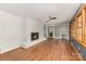 Open living room with fireplace, hardwood floors, and plenty of natural light at 507 Richards Dr, Shelby, NC 28150