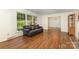 Living room with a leather sofa, hardwood floors, and natural light at 507 Richards Dr, Shelby, NC 28150